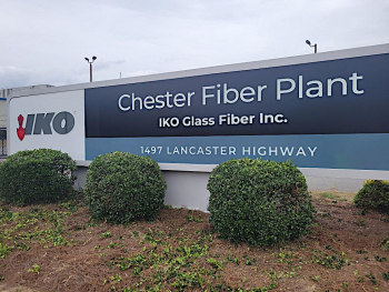 The new sign goes up for the IKO Glass Fiber plant in Chester County, South Carolina.